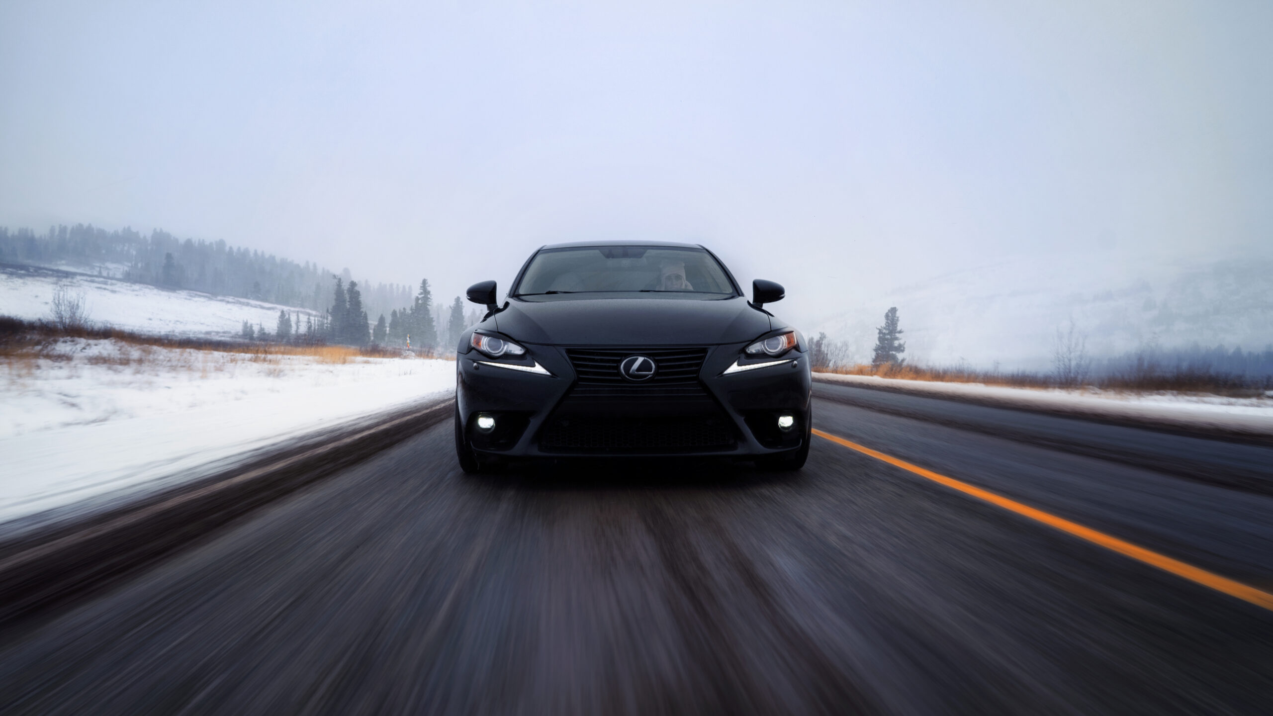 Helsinki, Finland - January 23, 2022 Lexus IS 250 on the road in the forest in winter
